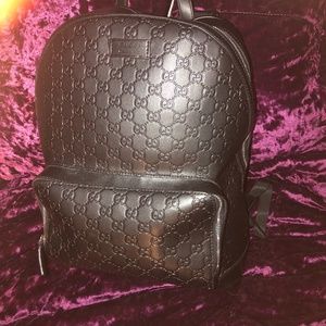 Gucci black leather embossed GG backpack